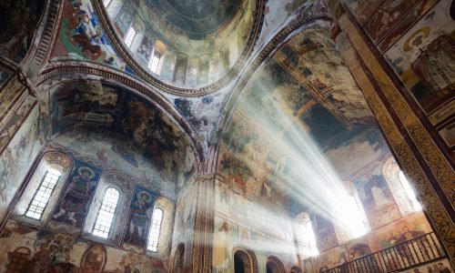 Sunbeams in ornate church window